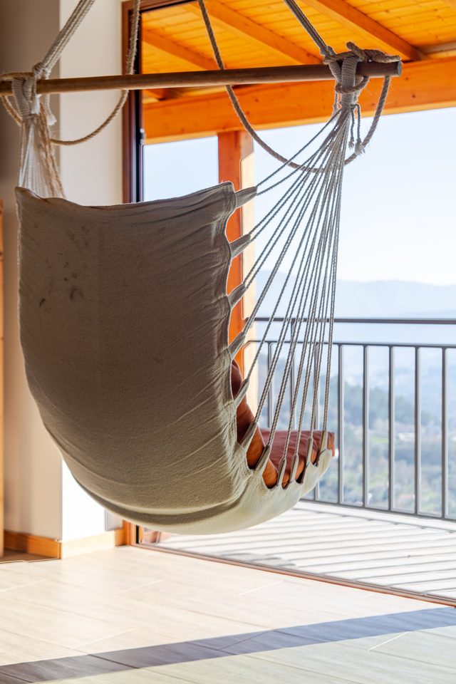 Relaxing hanging chair on balcony at Casa do Sol, Celorico de Basto